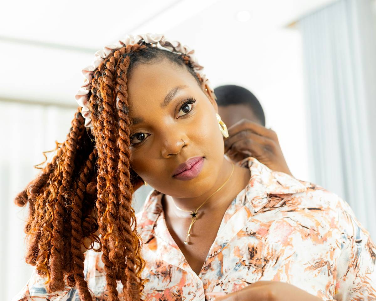 Close-up of Afro-Friendly Techniques being applied to natural hair with feed-in braids and sealed edges